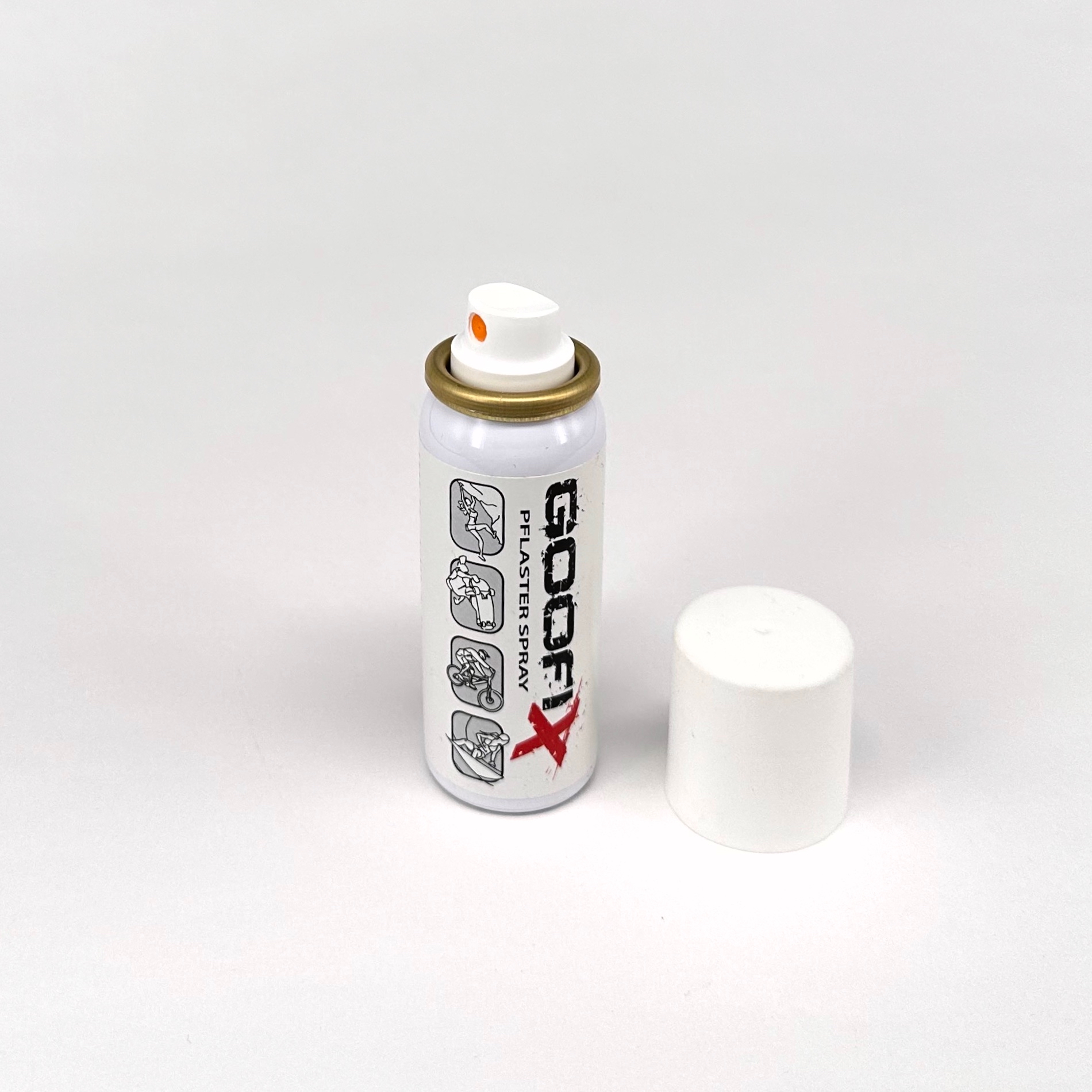 goofix 03 Eine kleine Spraydose mit der Aufschrift ‚GOOFYX‘ steht aufrecht vor einem weißen Hintergrund. Der Deckel liegt daneben. Oben ist ein Sprühknopf sichtbar.